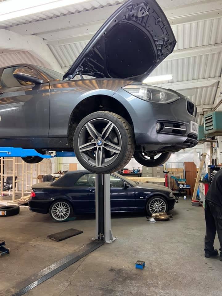 BMW on the lift with the bonnet up